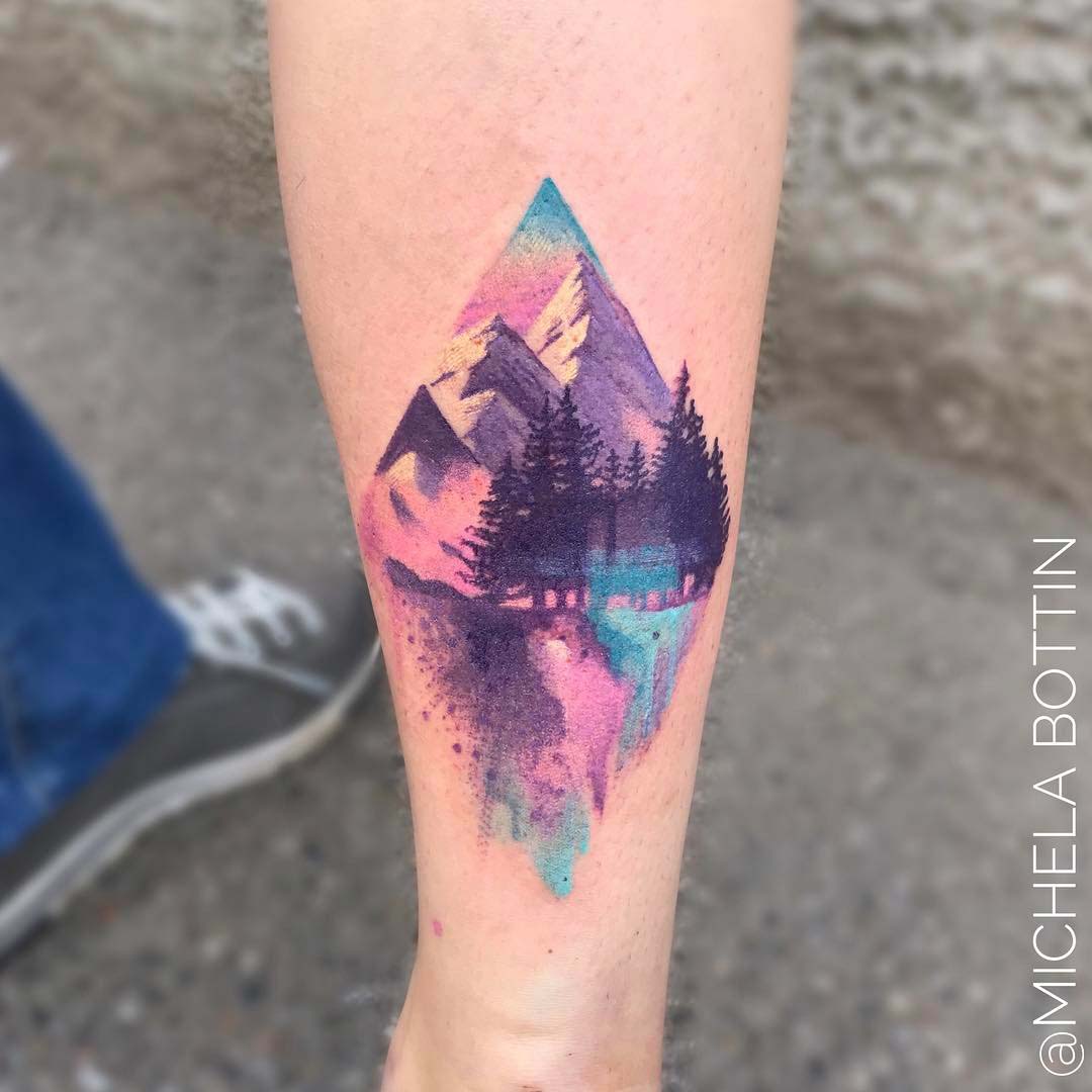 mountain watercolor tattoo on calf