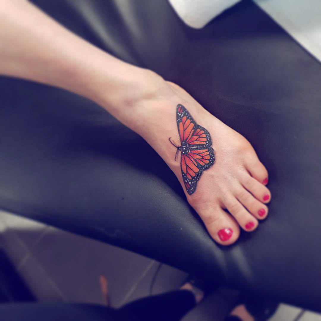 foot butterfly tattoo