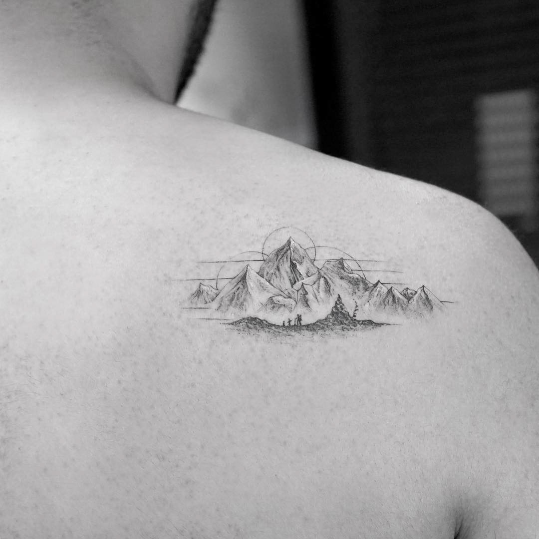 shoulder blade tattoo mountains