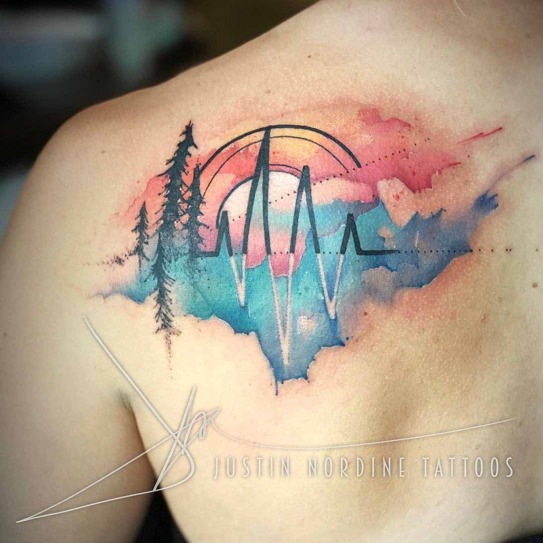 watercolor tattoo on shoulder blade pulse