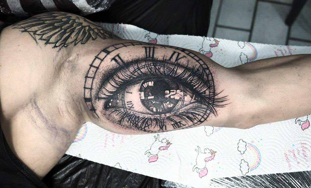 bicep tattoo eye