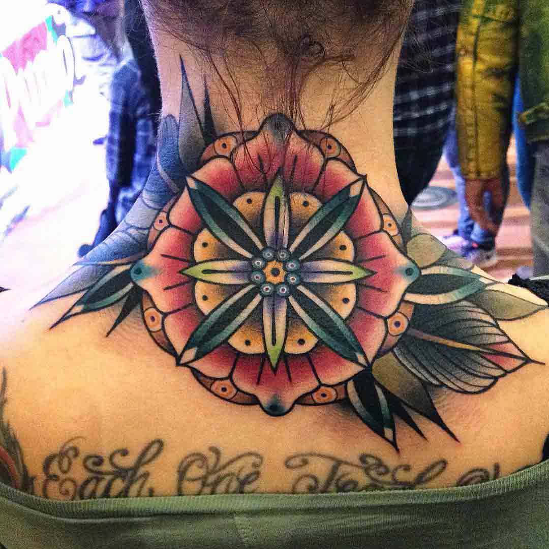 traditional flower tattoo on back of the neck
