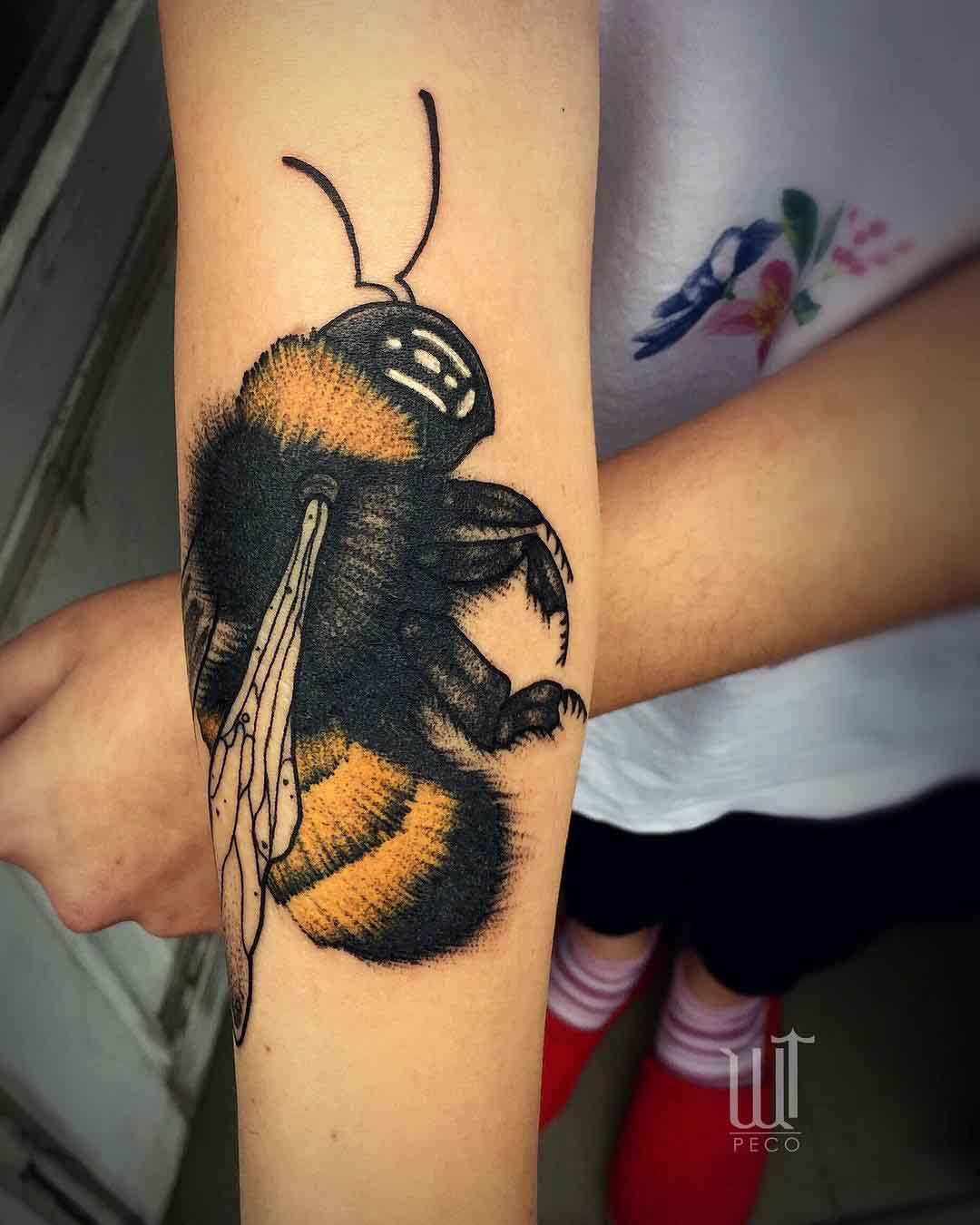 arm tattoo bumble bee
