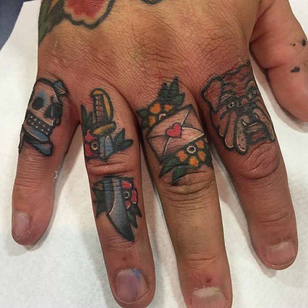 small traditional tattoos on fingers