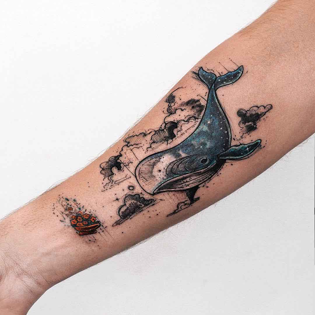arm tattoo whale in the sky