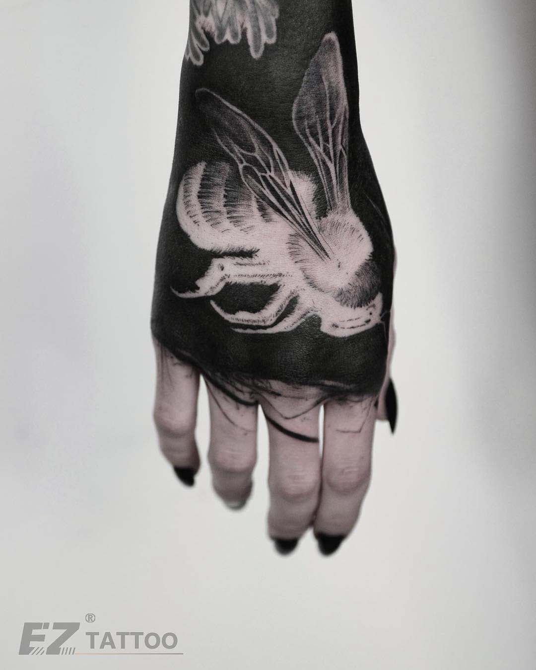 hand tattoo white inks bee