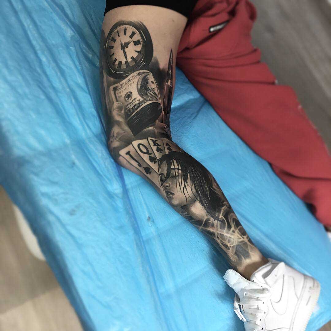blackwork tattoo sleeve on leg