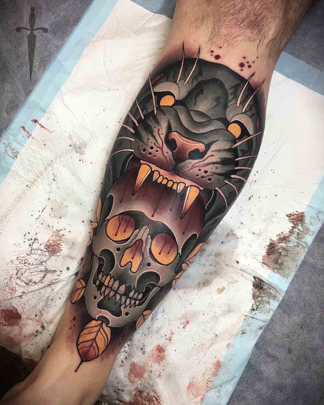 calf tattoo skull and tiger