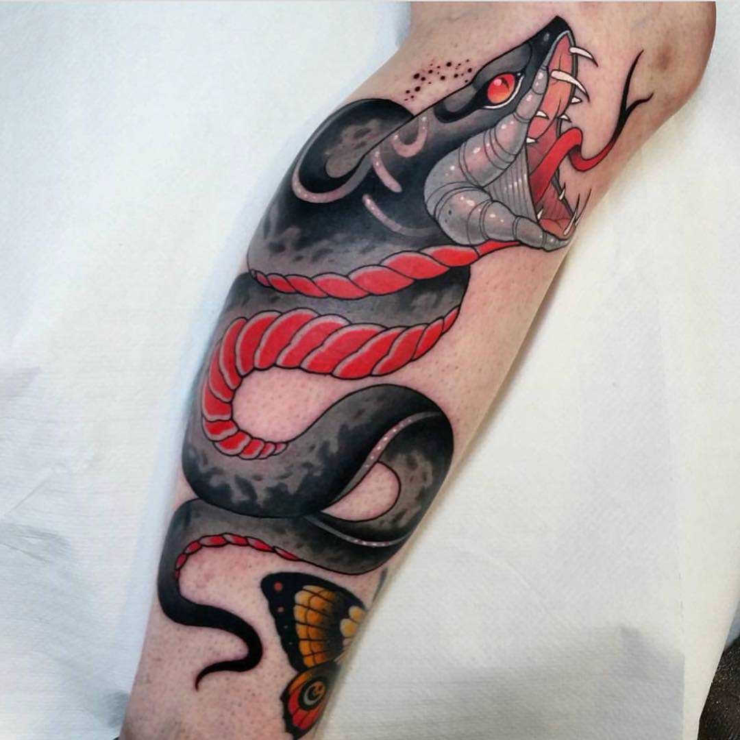 black snake tattoo on forearm