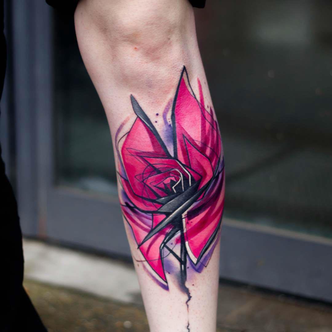 pink rose tattoo on arm