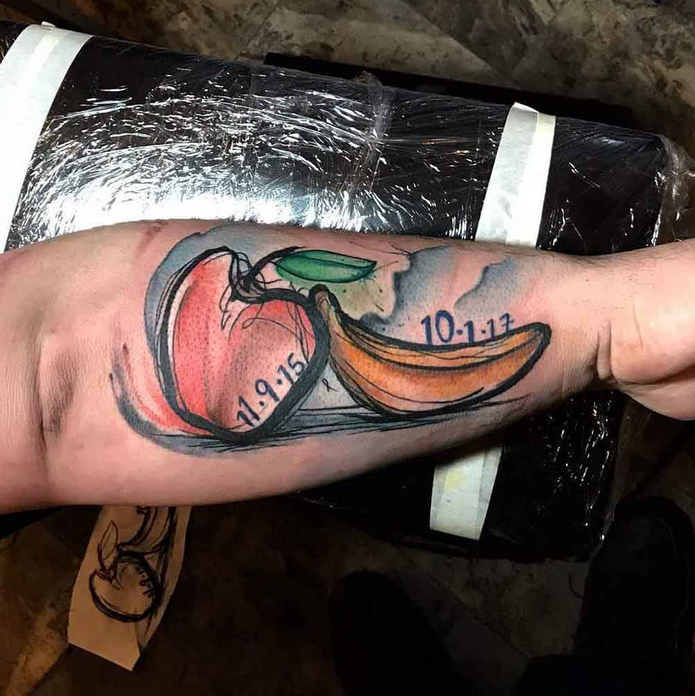 arm tattoo fruits apple and banana