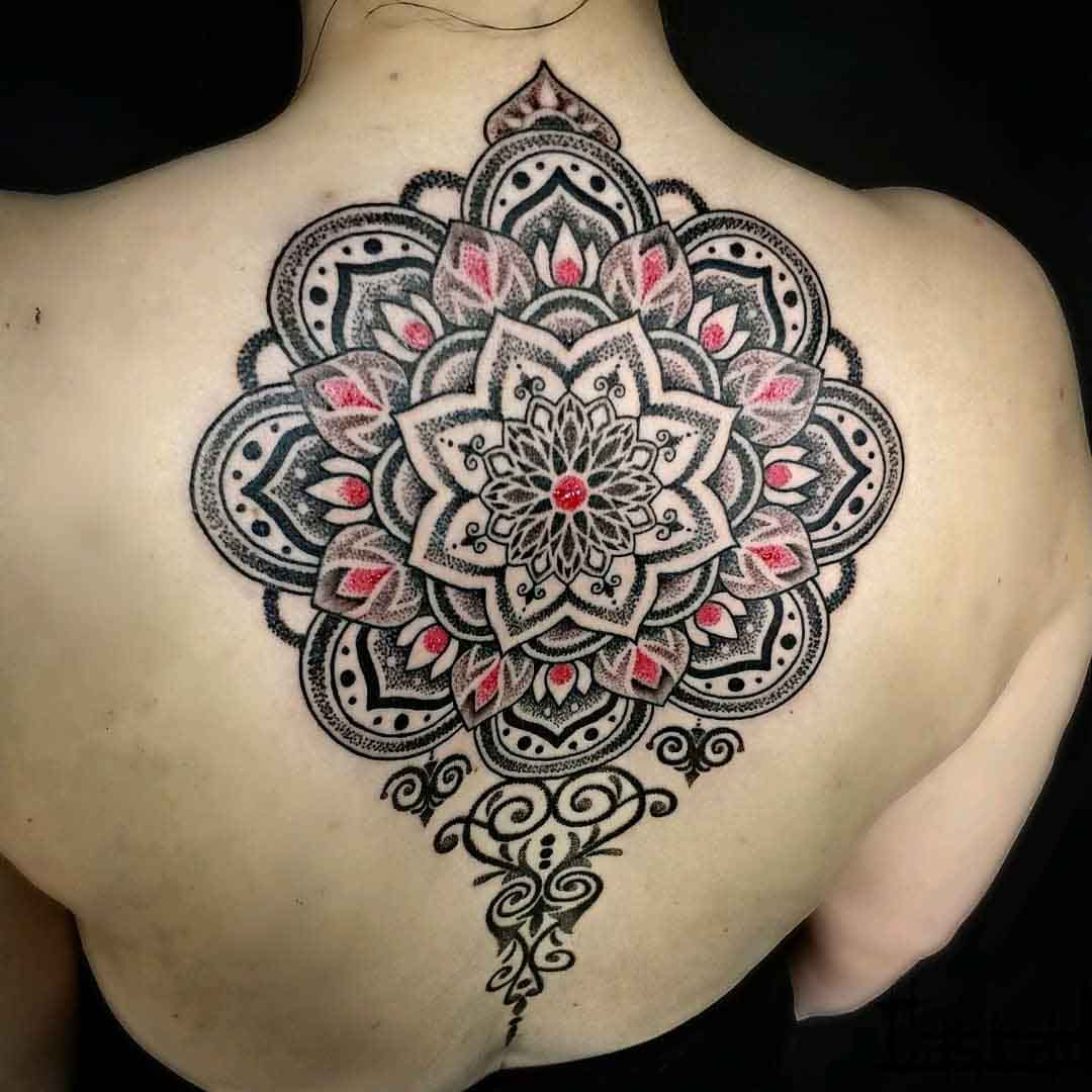 mandala tattoo on upper back black and red dotwork