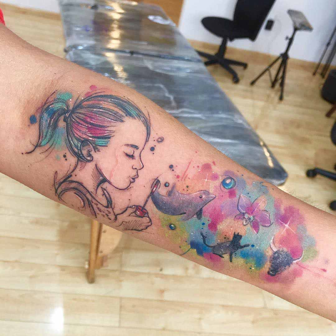 imagination tattoo on arm watercolor style