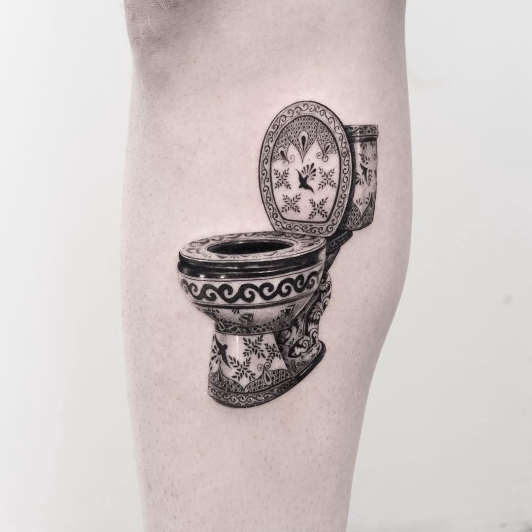 arm tattoo toilet