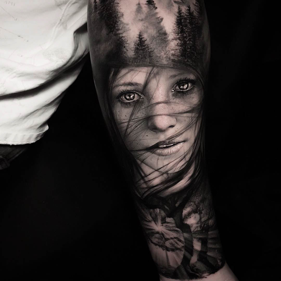 black and grey tattoo on arm