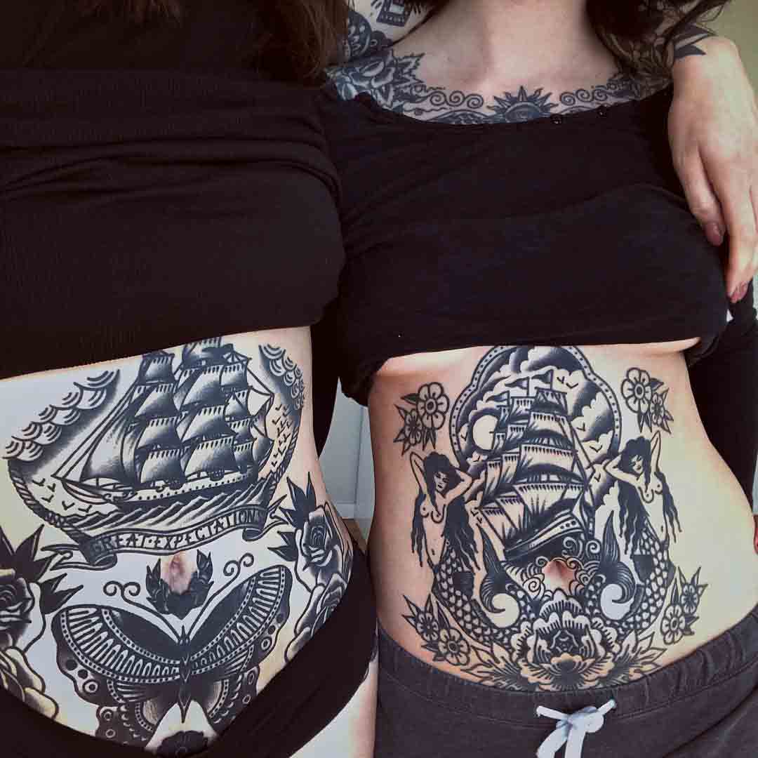 two ship tattoos on stomach