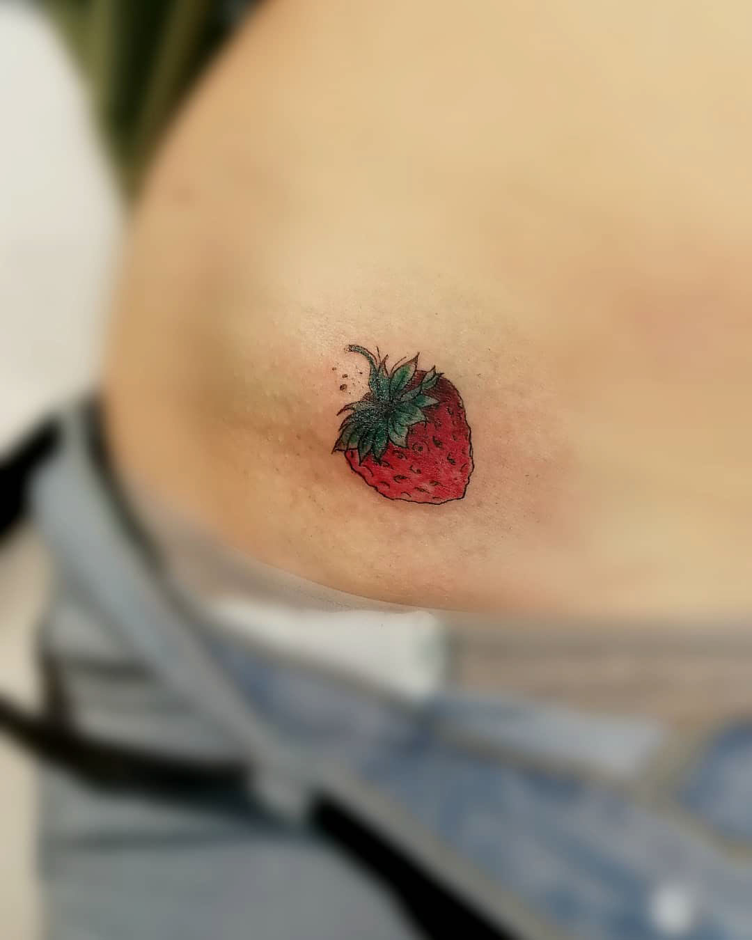 small strawberry tattoo