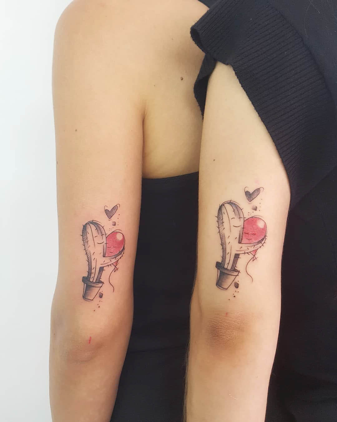 couple tattoo cactus with balloons