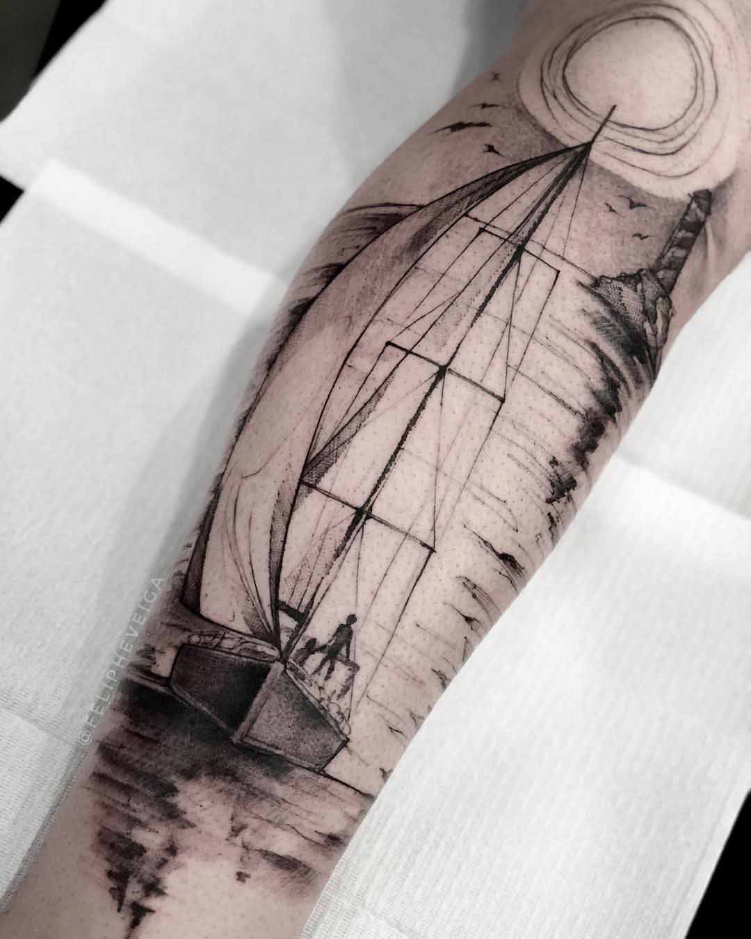 arm tattoo sailing sunset