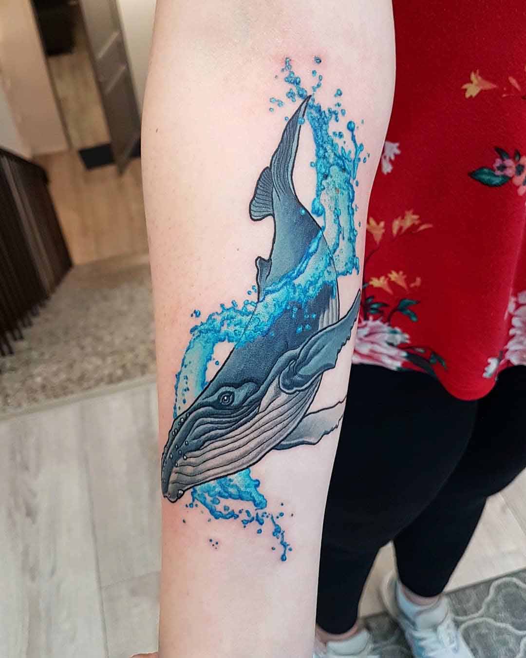 arm tattoo blue whale