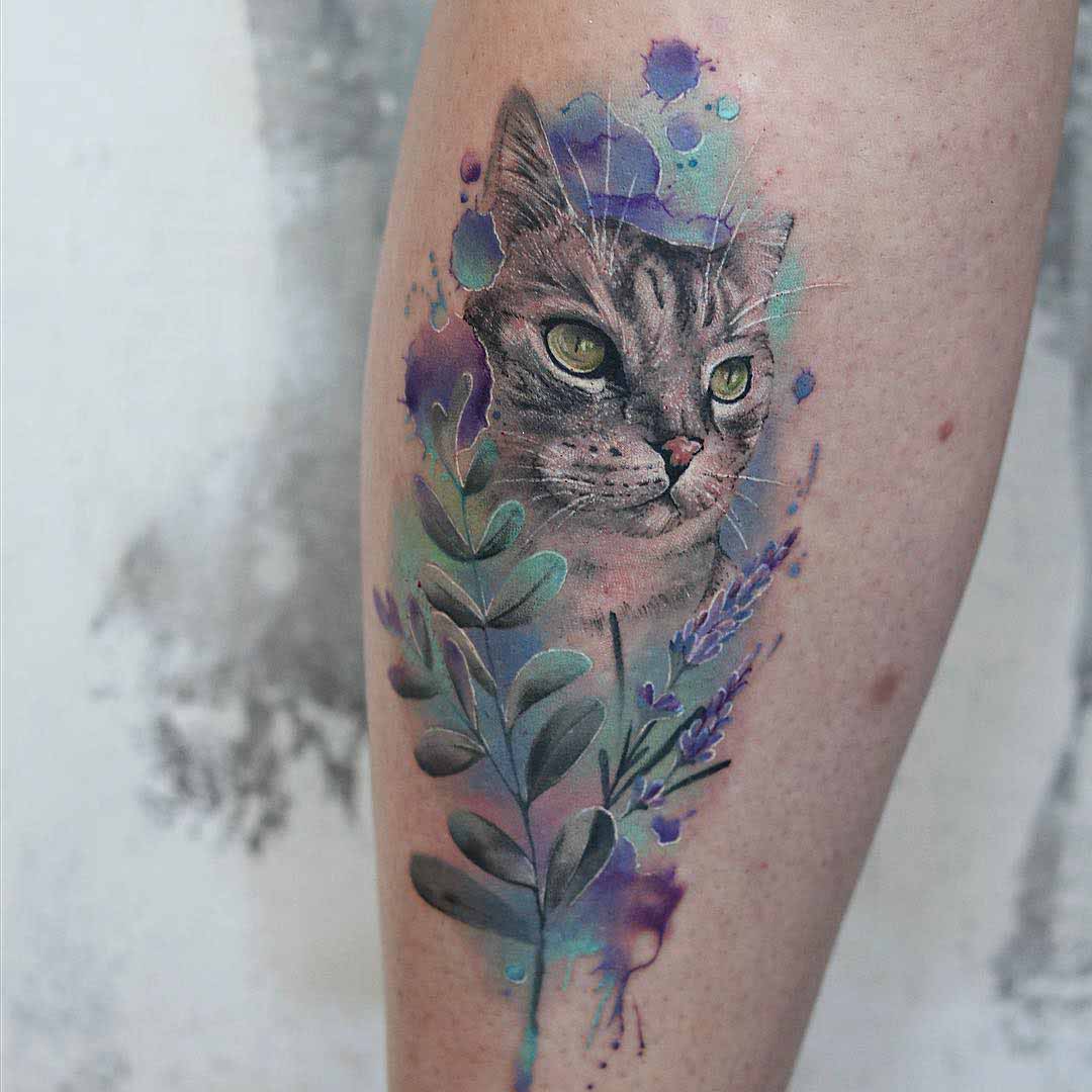 Watercolor cat tattoo on the right side of the pelvis