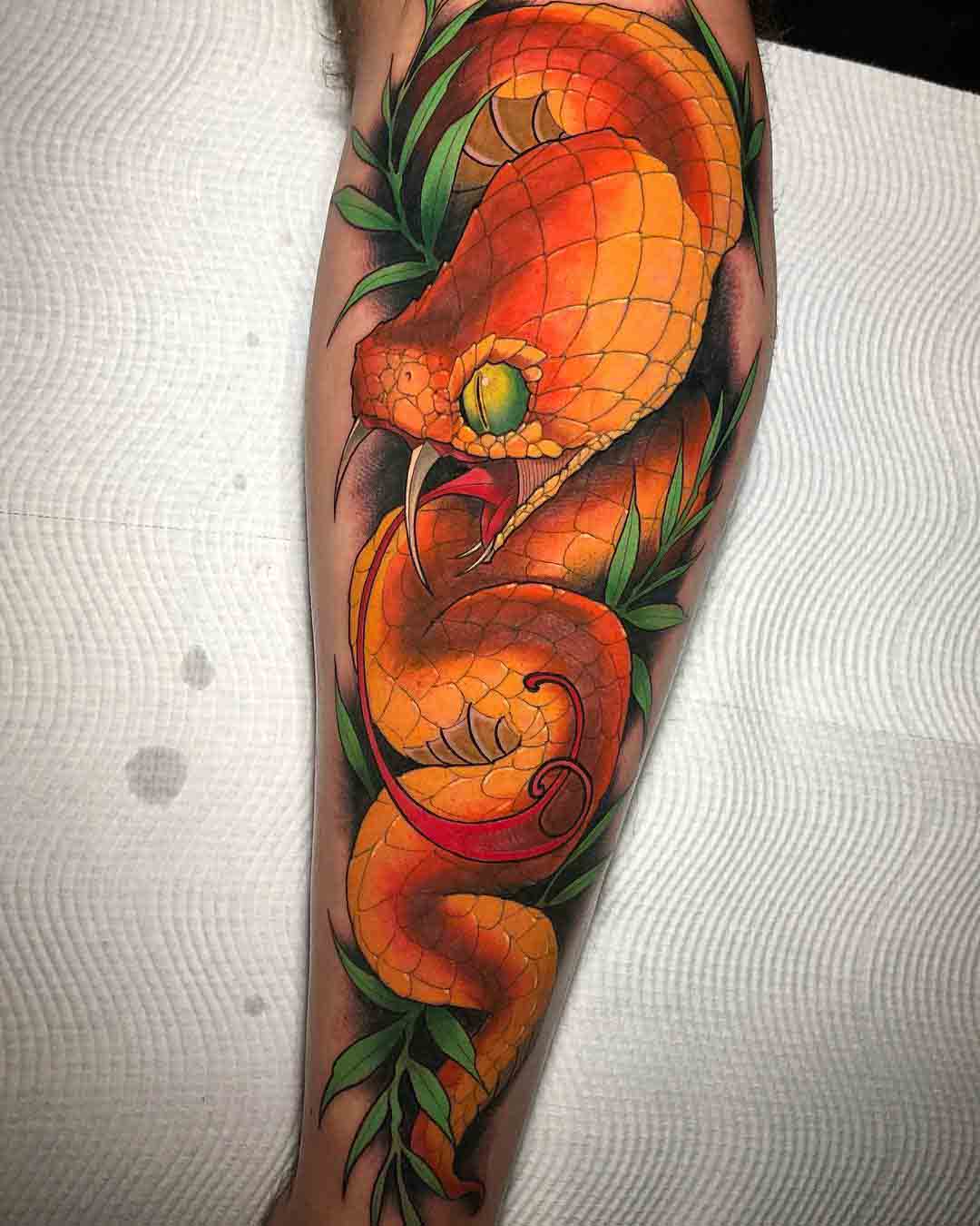 arm tattoo snake orange viper