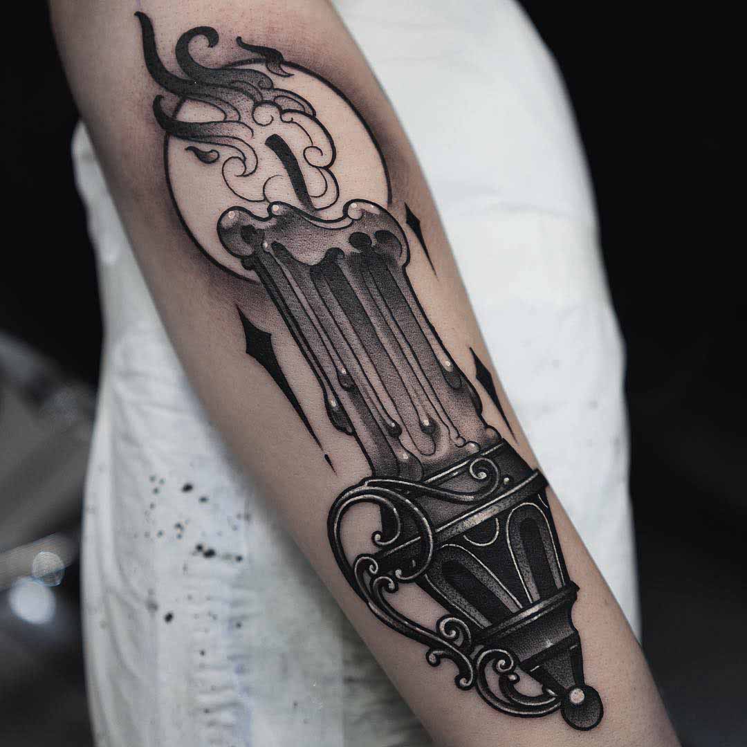 candle tattoo on arm