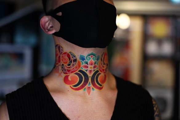 Asian Ink and Art's tattoo artist amayratattoo has created a stunning Barong mask tattoo that spans from the full neck to the chest. This Japanese tattoo is an impressive example of a chest piece tattoo and a full neck tattoo.